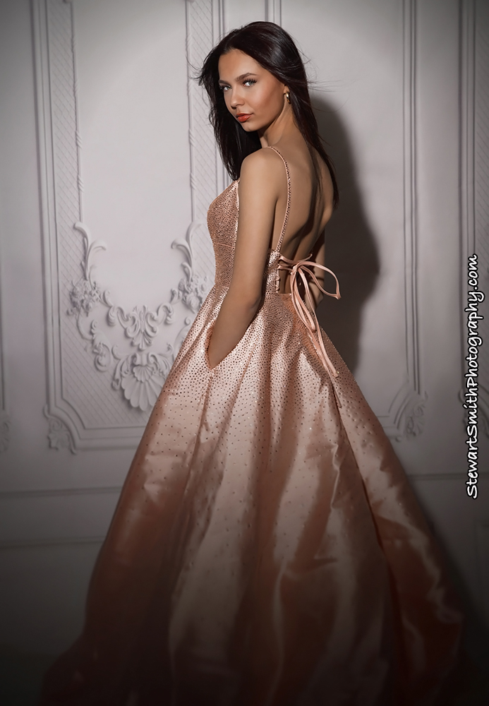 Emma Brown poses in a pink gown during her modeling portfolio session with Maine professional photographer Stewart Smith showcasing elegance and style.